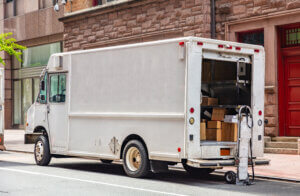 white color truck delivering packages, manhattan downtown